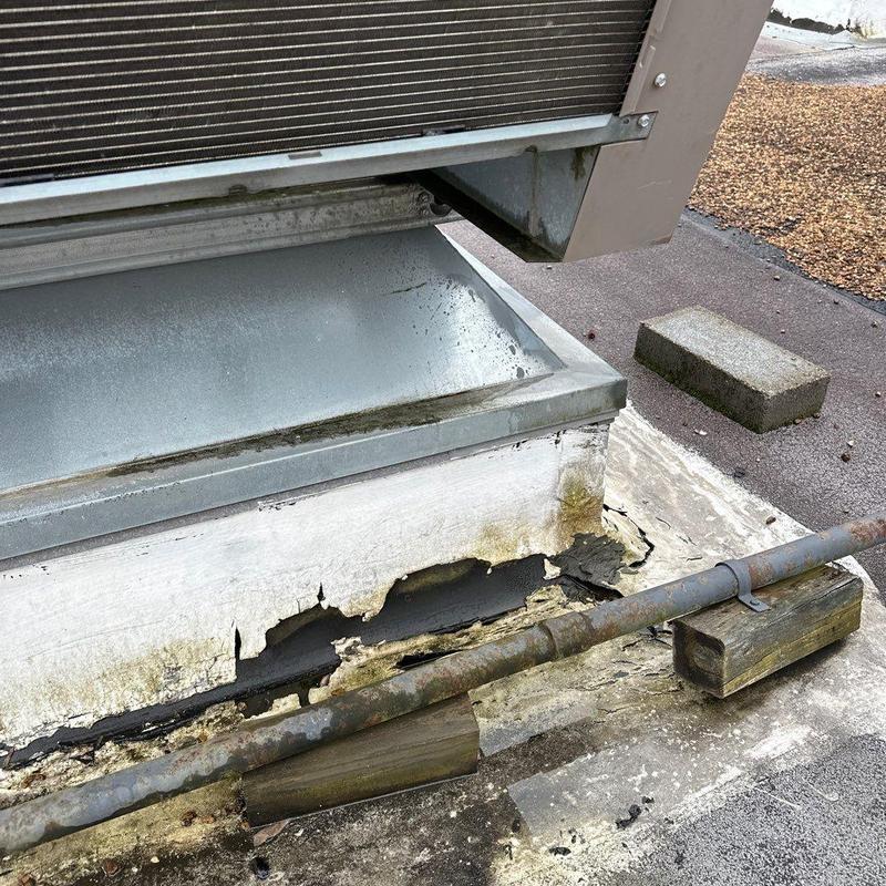Rooftop HVAC unit base corrosion and damage