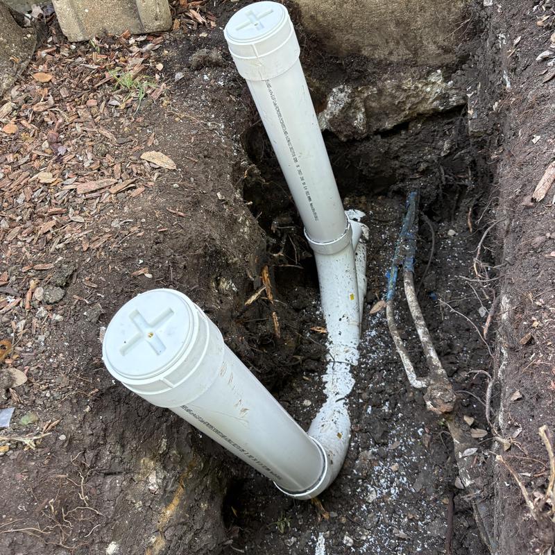 4-inch PVC sewer drain line with cleanouts in trench