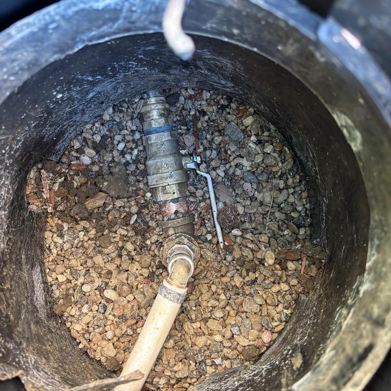 Main water line with ball valve inside access pit