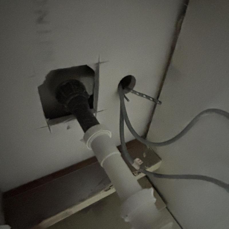 Bathroom sink drainage pipe replacement in wall cavity