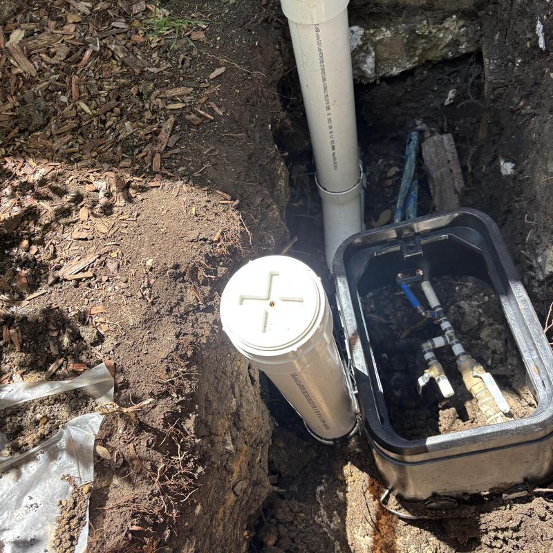 Outdoor irrigation valve box with piping and connections