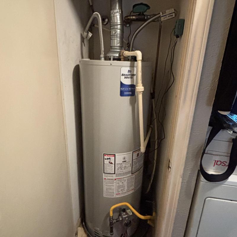 Bradford White gas water heater with plumbing connections