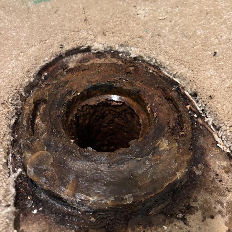 Cast iron toilet flange corrosion and damage detail