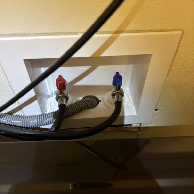 Laundry washer shut off valves with hoses installed