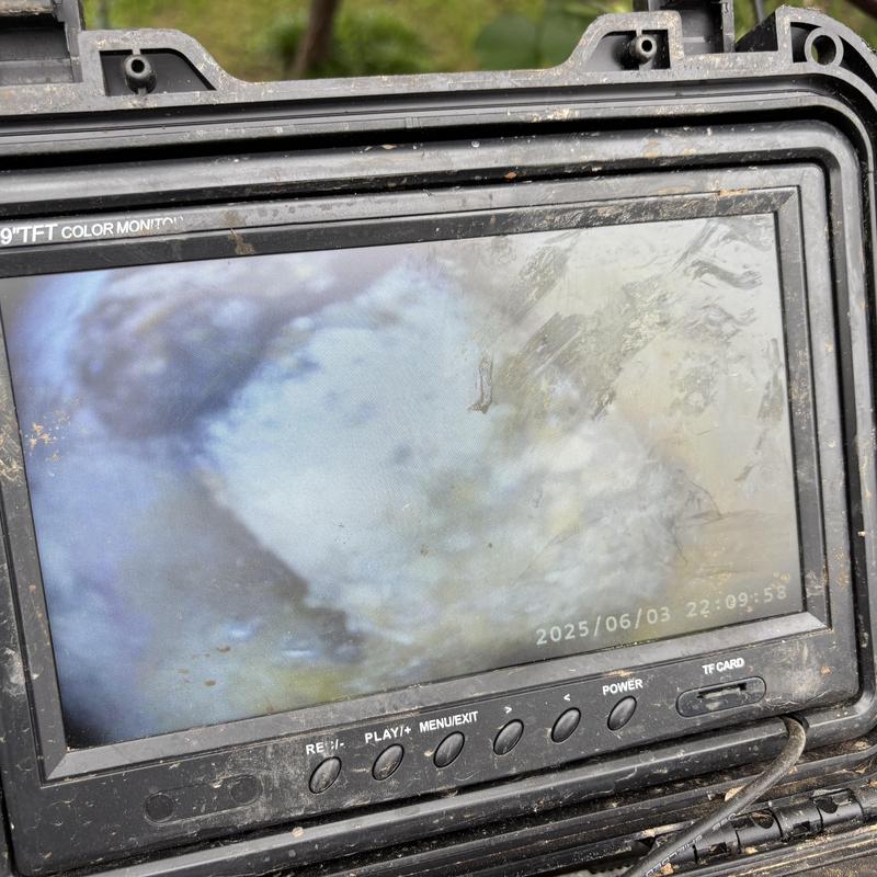 Sewer line video inspection monitor showing pipe interior