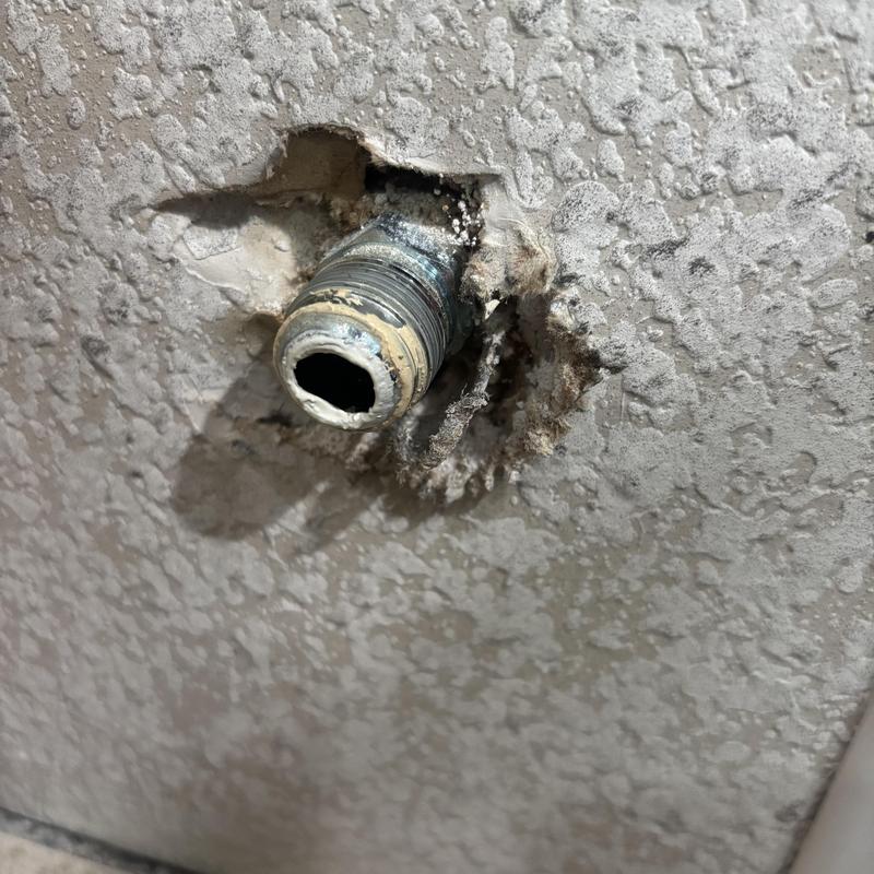 Stove gas shut off valve pipe protruding from wall