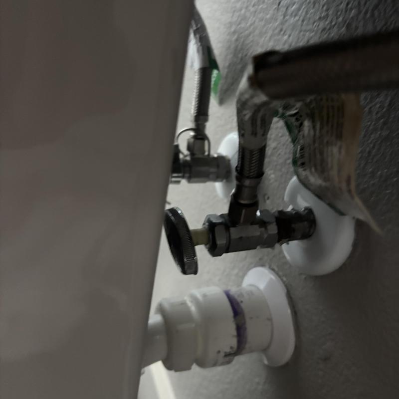 Toilet water supply valve and plumbing connections