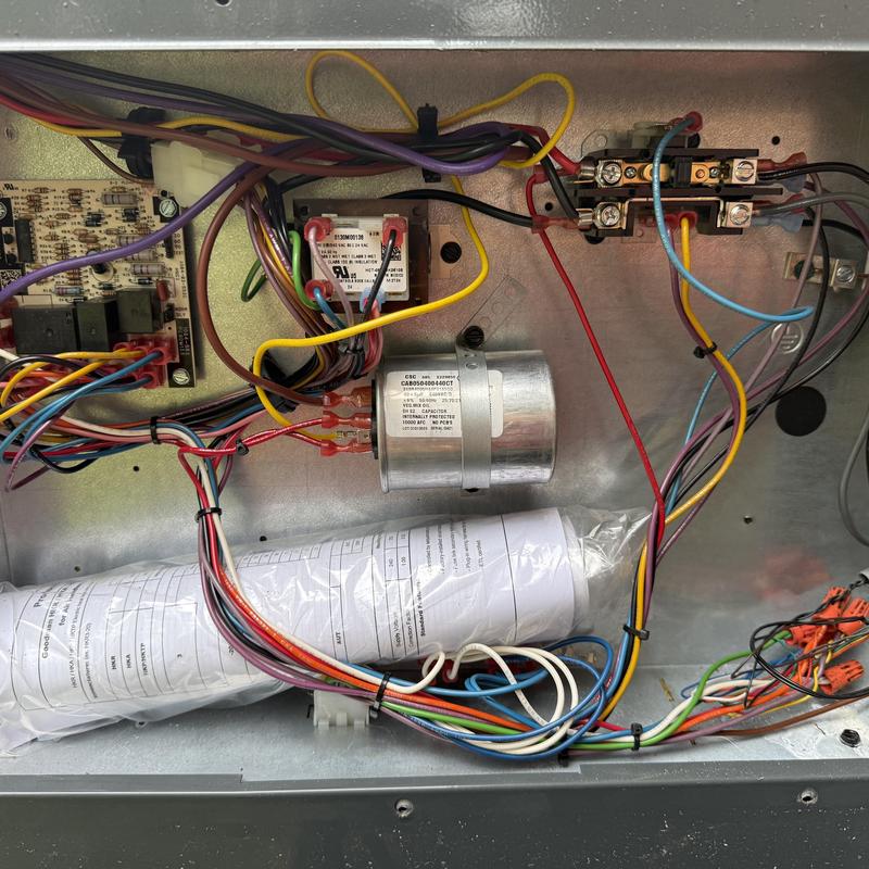 HVAC capacitor and electrical connections inside unit