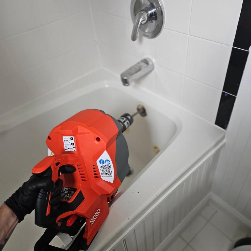 Tub drain clog removal with electric drain auger