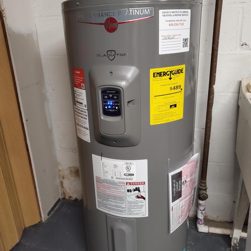 Electric water heater installation with control panel