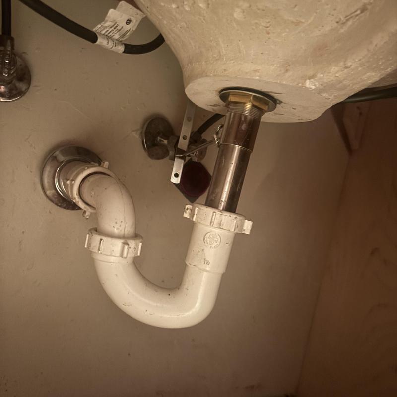 Bathroom sink drain pipe and trap installation