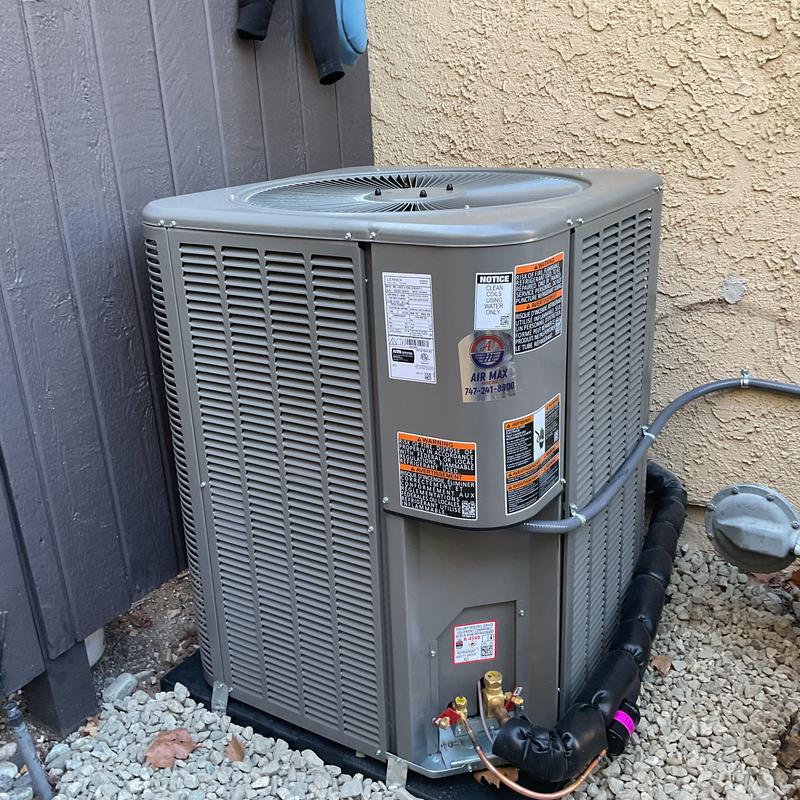 ML14KC1 condenser unit installed beside house wall