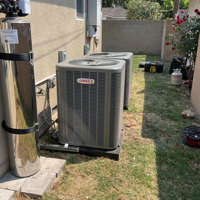 Lennox 3 and 3.5 ton AC units outside house