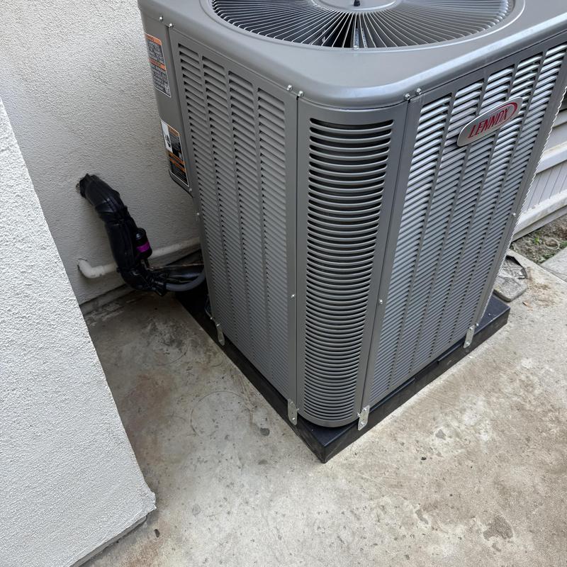 Lennox ML14KC1 condenser unit on concrete pad Lennox ML14KC1 condenser unit on concrete pad