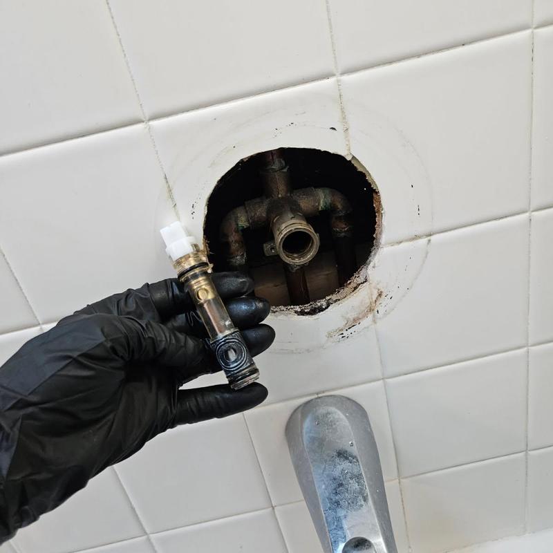 Tub and shower valve cartridge installation in tiled wall