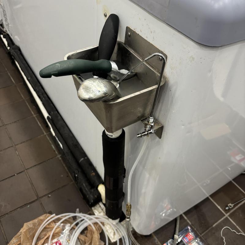 Stainless steel mop sink with faucet and water lines