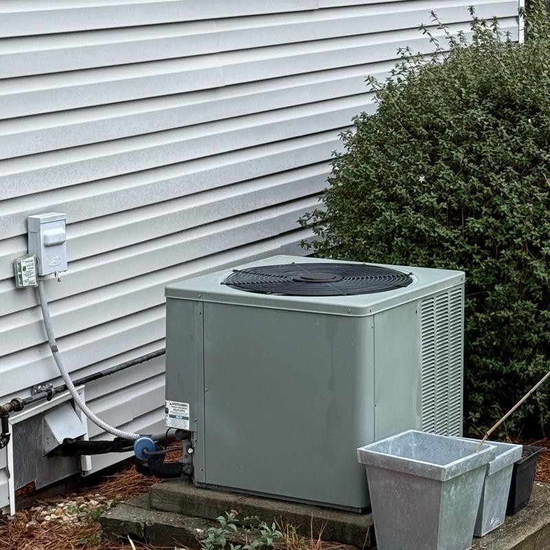Condenser unit with airflow restriction from overgrowth