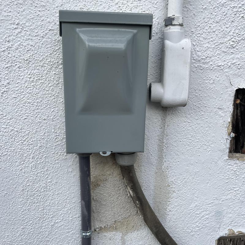 Electrical disconnect box on exterior wall