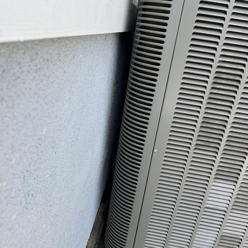 Lennox outdoor HVAC unit close to exterior wall