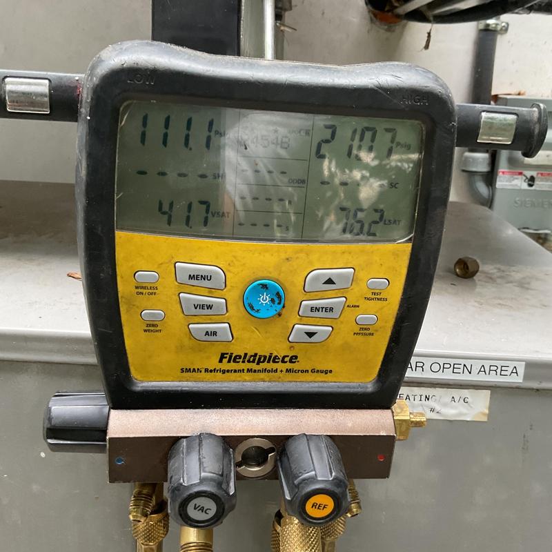 Refrigerant manifold gauge measuring HVAC pressures Refrigerant manifold gauge measuring HVAC pressures