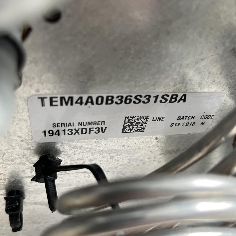Evaporator coil label and copper tubing close-up Evaporator coil label and copper tubing close-up
