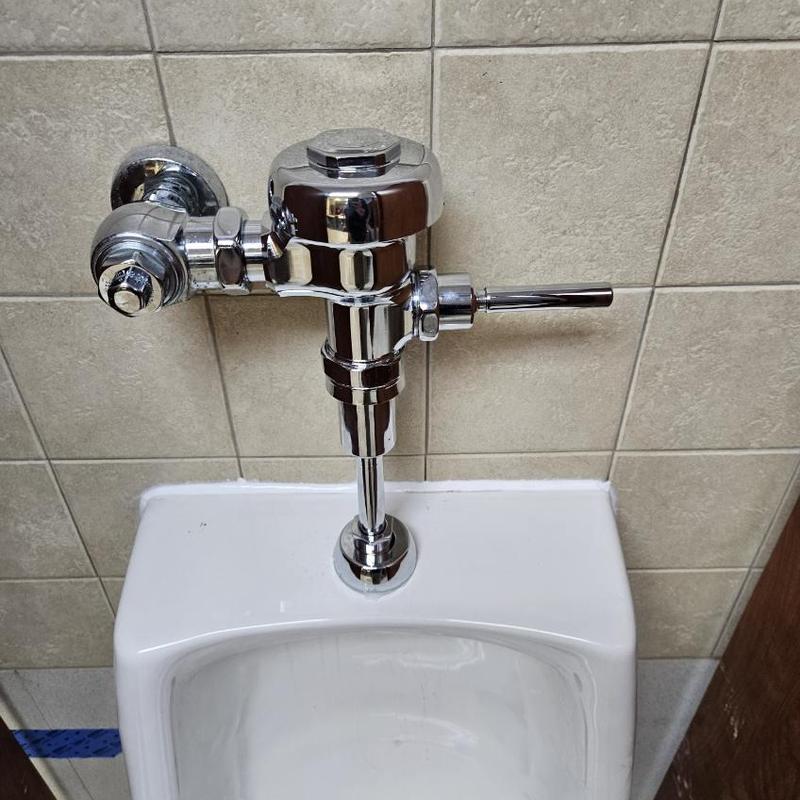 Urinal flush valve installation in Pasadena MD restroom