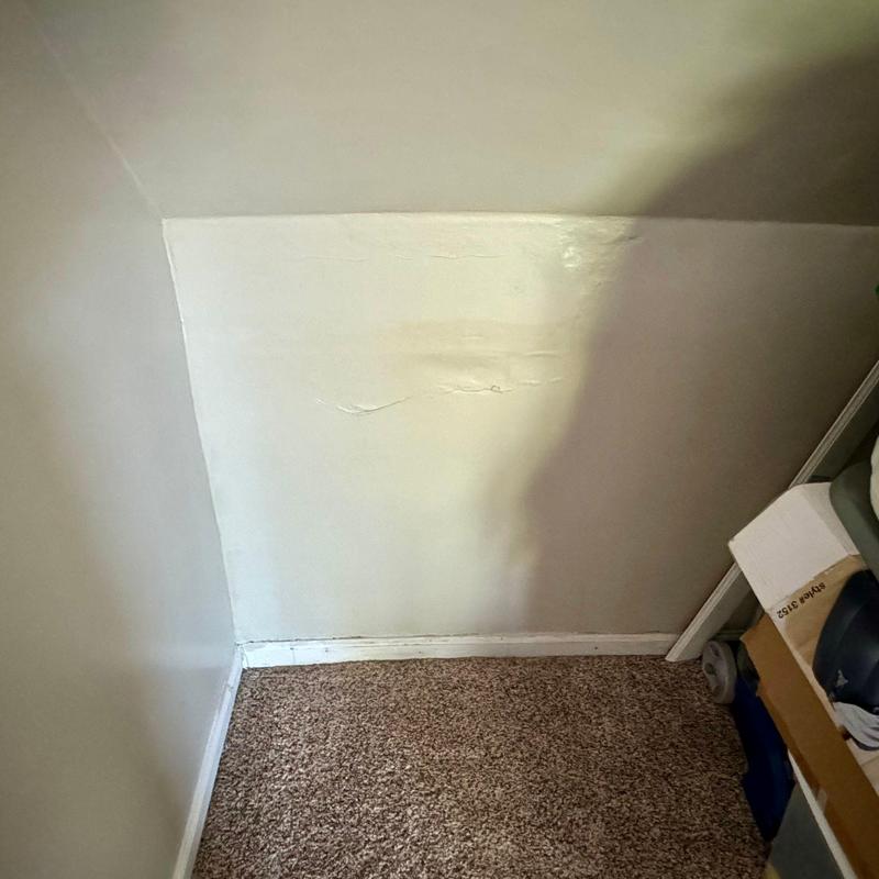 Wall drywall with water damage and cracking paint