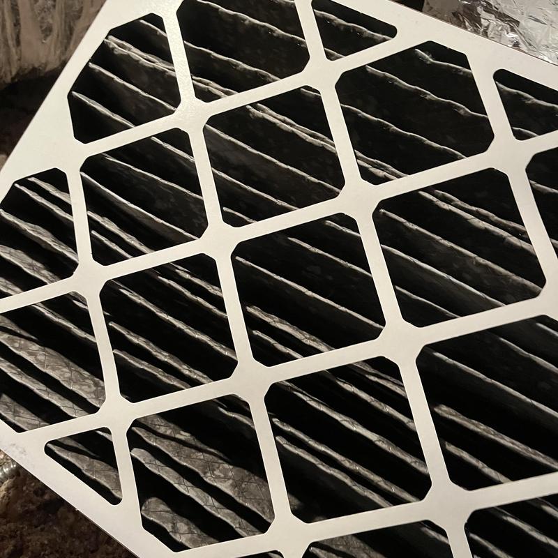 HVAC air filter with visible dust buildup