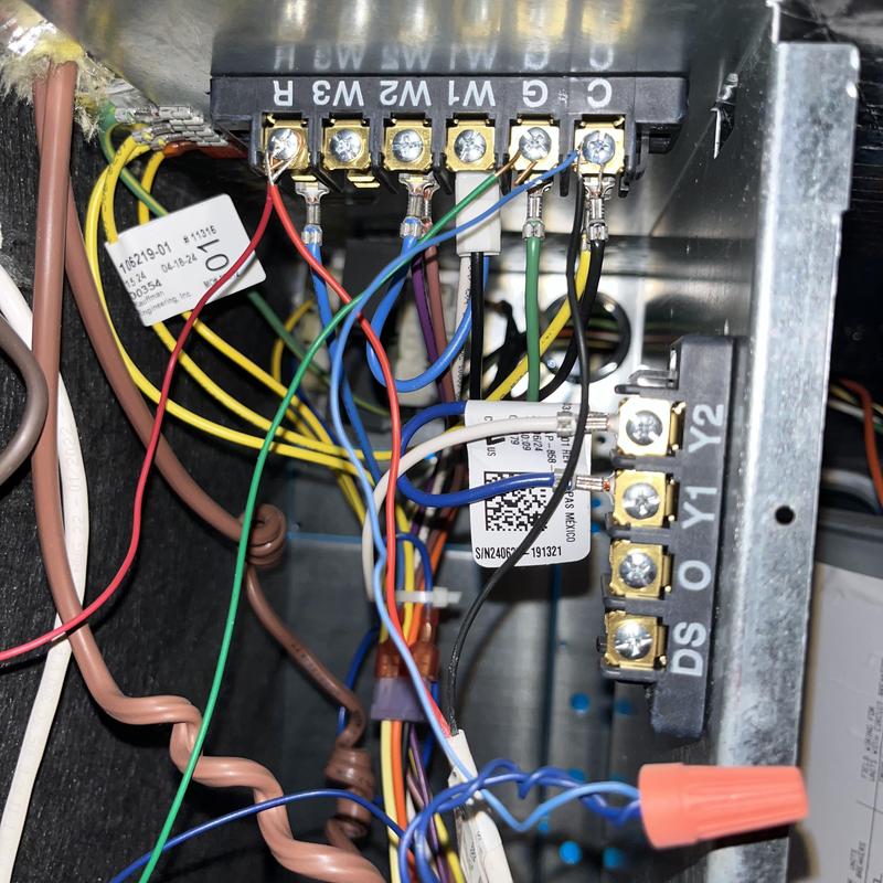 Thermostat wiring connections in HVAC control panel