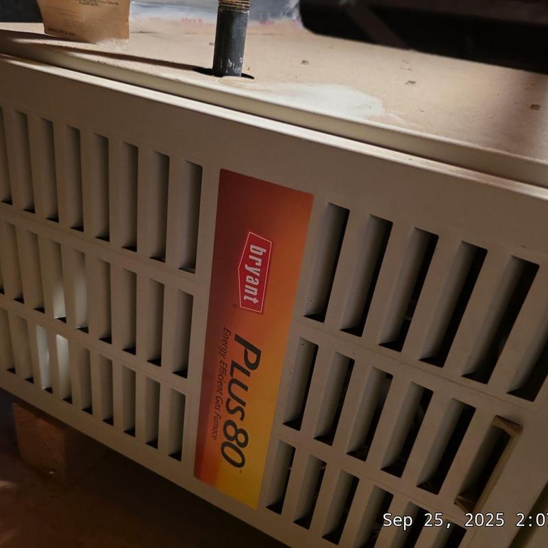 EL180 Bryant furnace with vent pipe and label