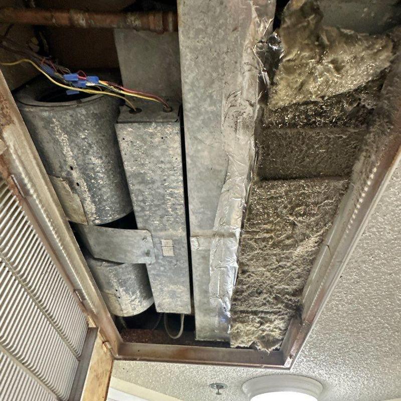 HX Ceiling Fan Coil air handler with ductwork dust buildup