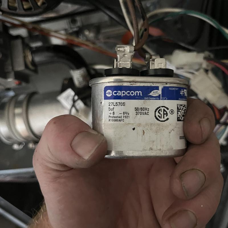 HVAC capacitor held during preventative maintenance HVAC capacitor held during preventative maintenance