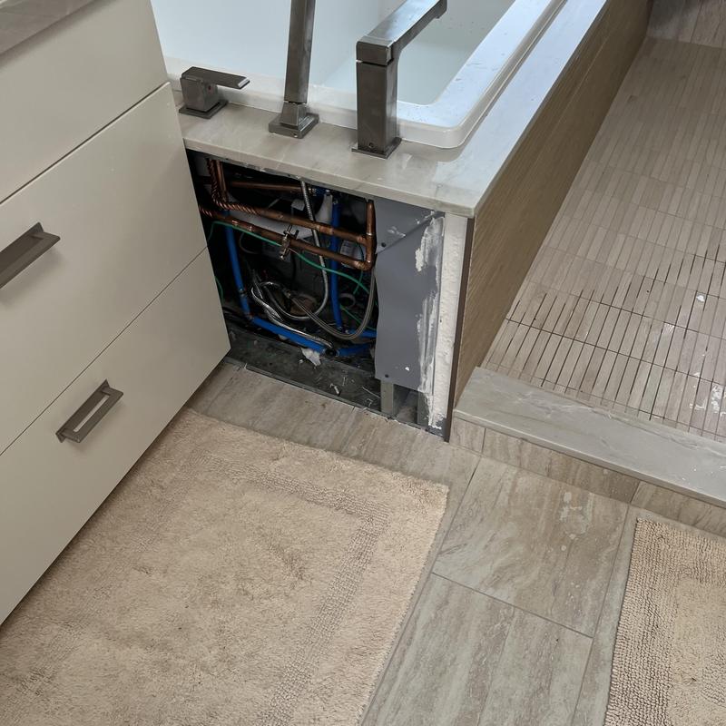 Tub valve and spout plumbing repositioned and tested