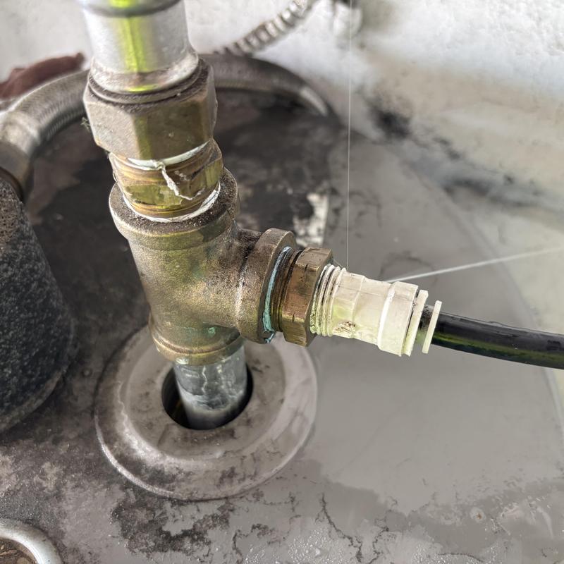 Water heater brass fitting replacement on pipe connection