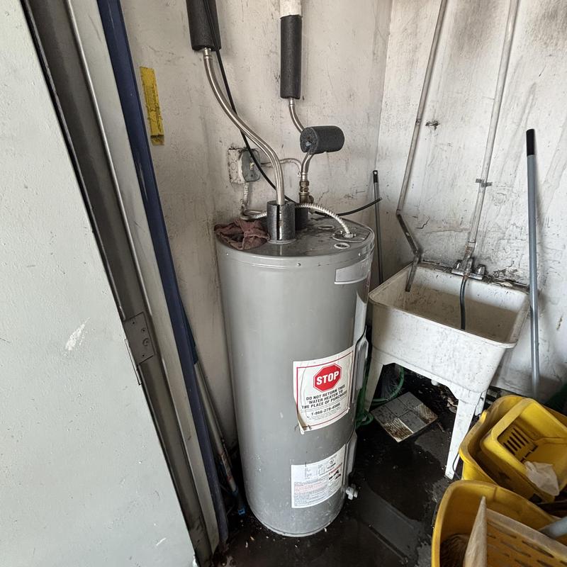 Water heater with new brass pipe fitting installation