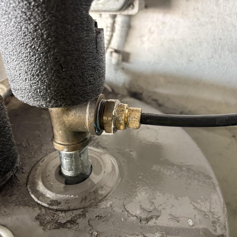 Water heater brass fitting replacement with hose connection