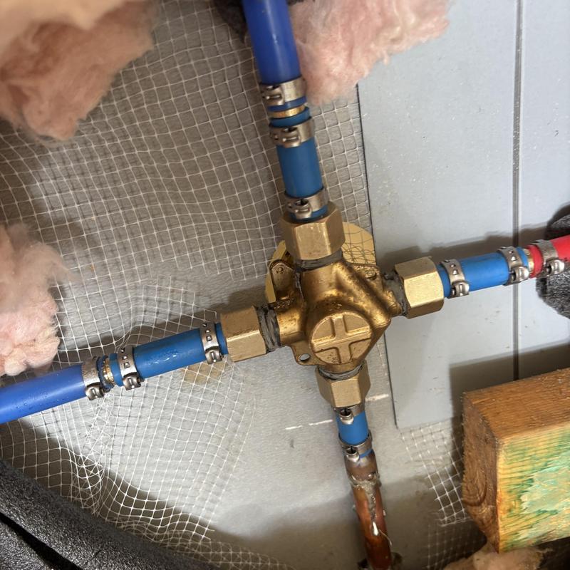 Moen shower valve with blue PEX piping installation