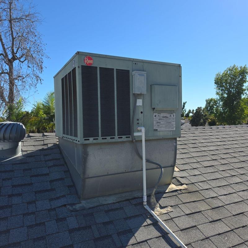 Rheem package rooftop HVAC unit with new ducting