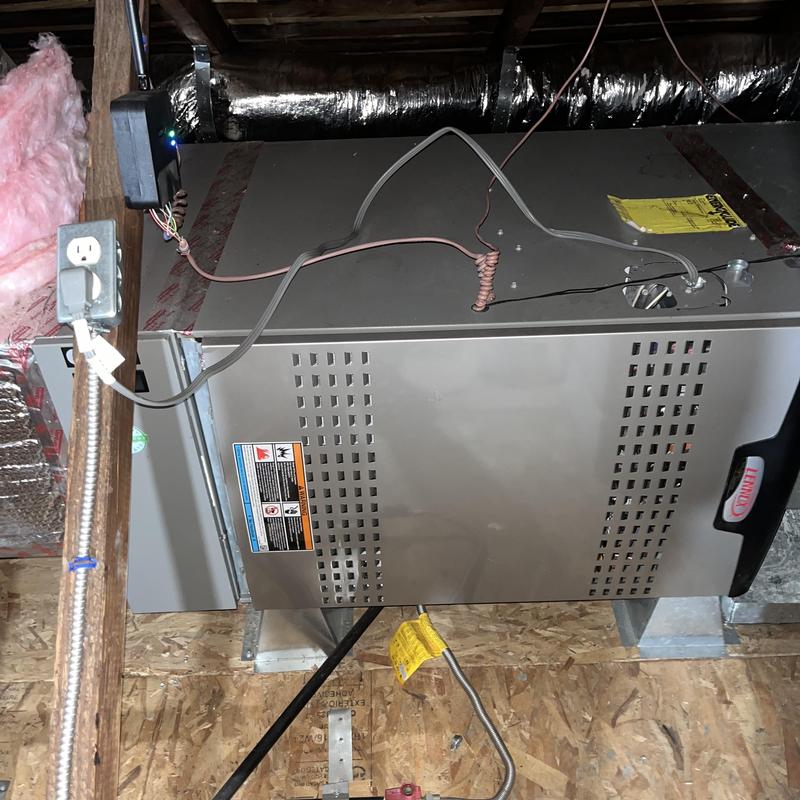 Furnace unit in attic with wiring and ductwork Furnace unit in attic with wiring and ductwork