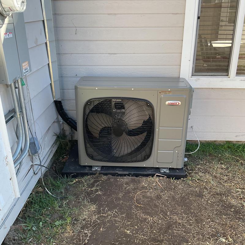 EL18KSLV condenser unit installed outside home