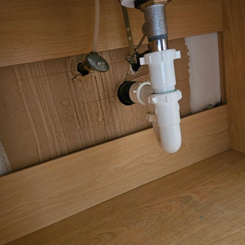 Lavatory pop-up drain and P-trap installation under sink