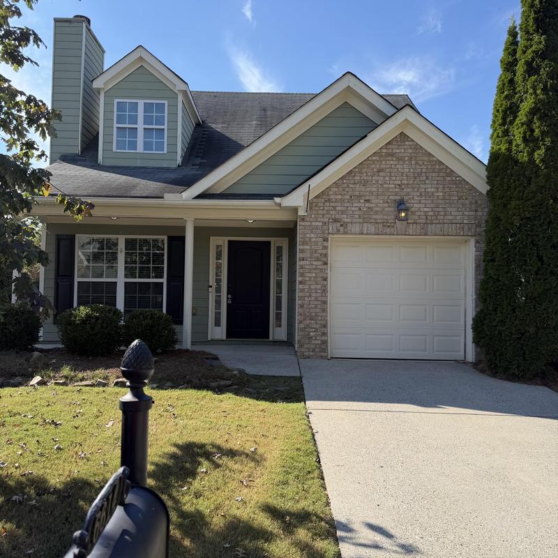 Roof shingles inspection on suburban home exterior