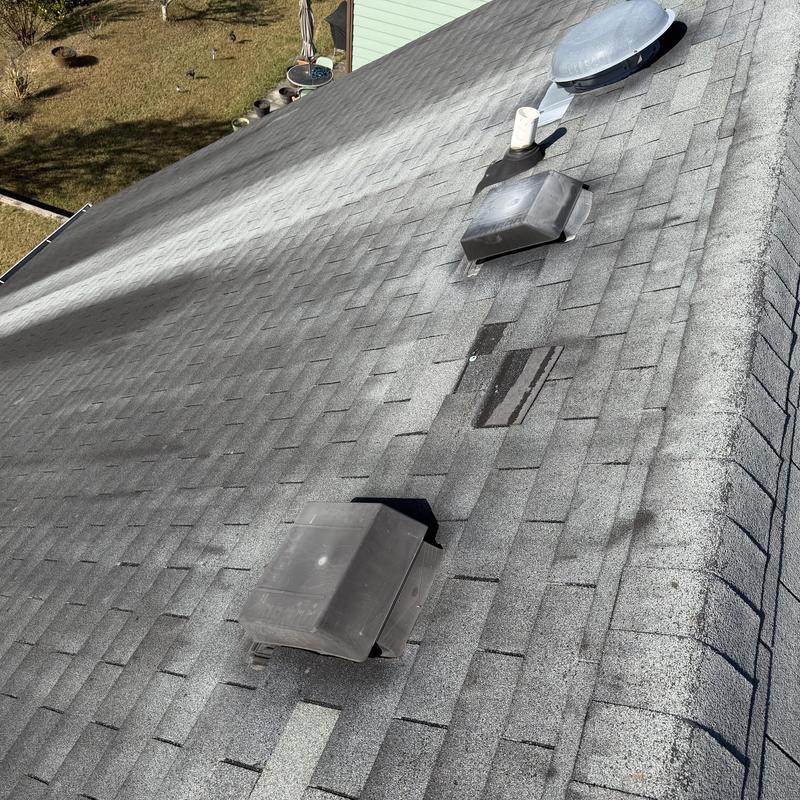 Roof shingles with ventilation covers and missing shingles