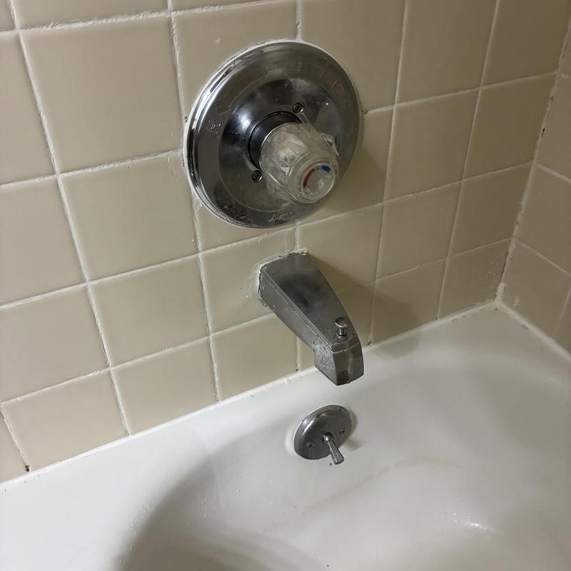Delta tubshower faucet handle and spout with tiles