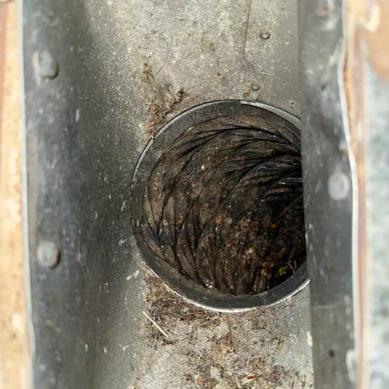 HVAC ductwork interior showing dust and debris buildup