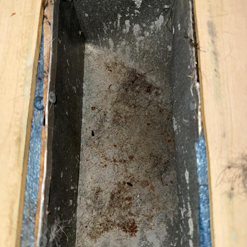 HVAC duct interior with dust and debris buildup
