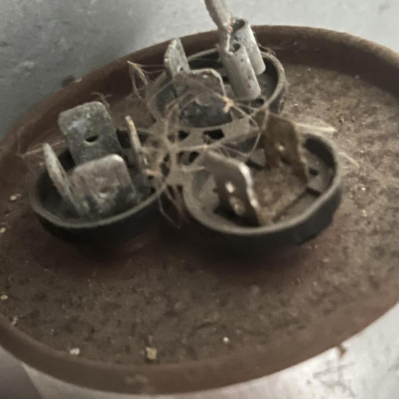 HVAC capacitor terminals with dust and cobwebs