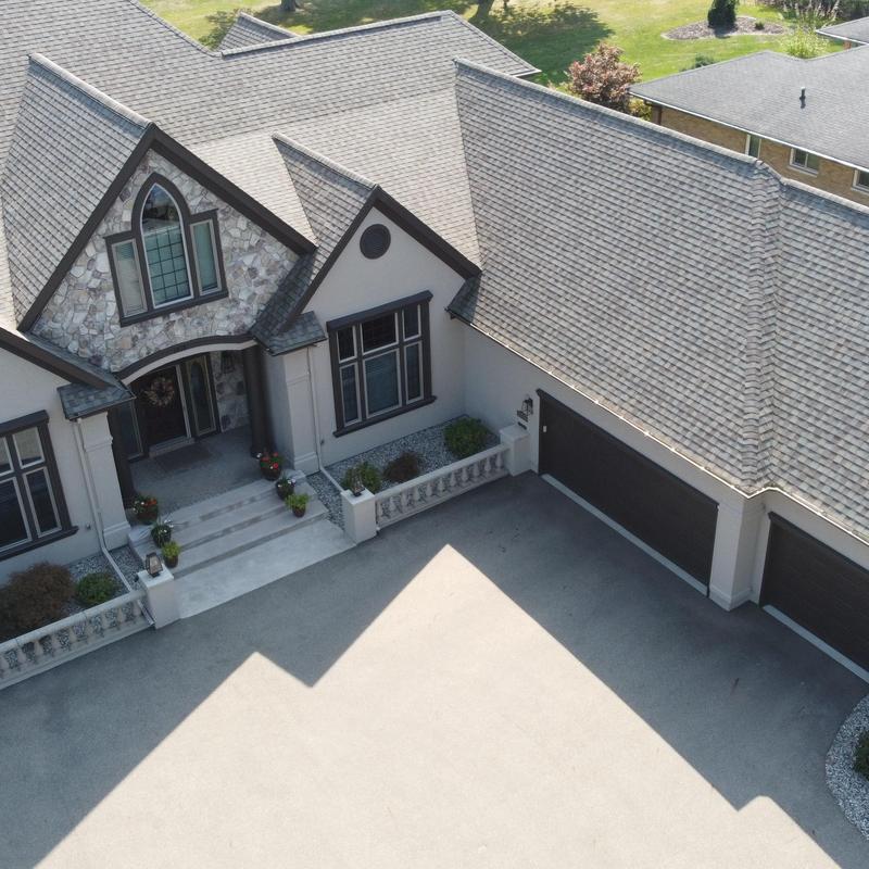 Exterior trim and siding painting with dark bronze accents Exterior trim and siding painting with dark bronze accents