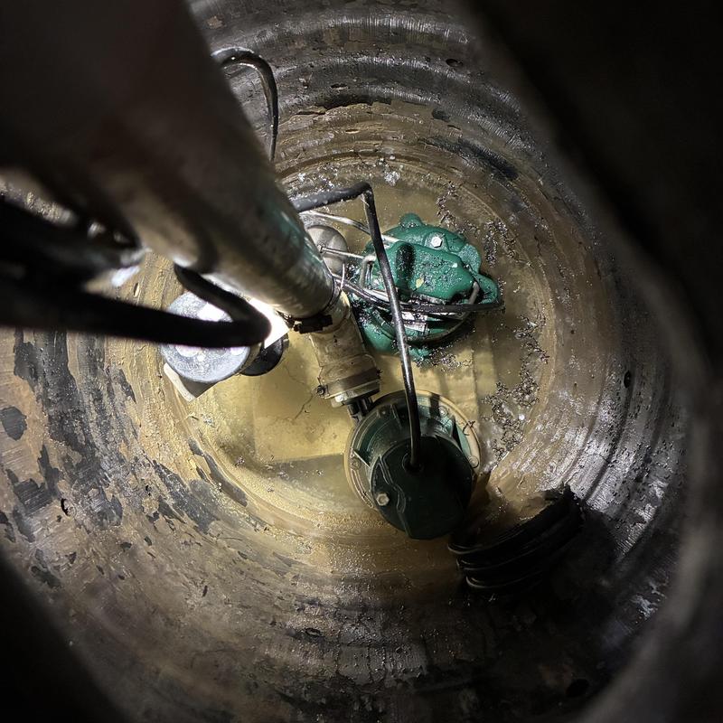 Primary sump pump installation in pump basin