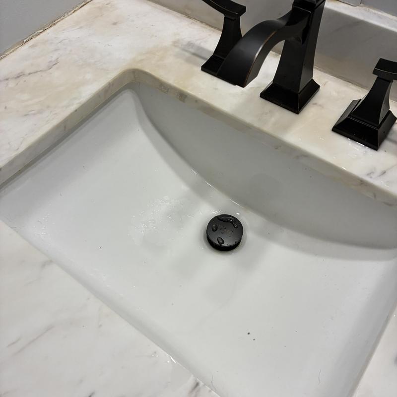 Widespread lavatory faucet with black handles installed